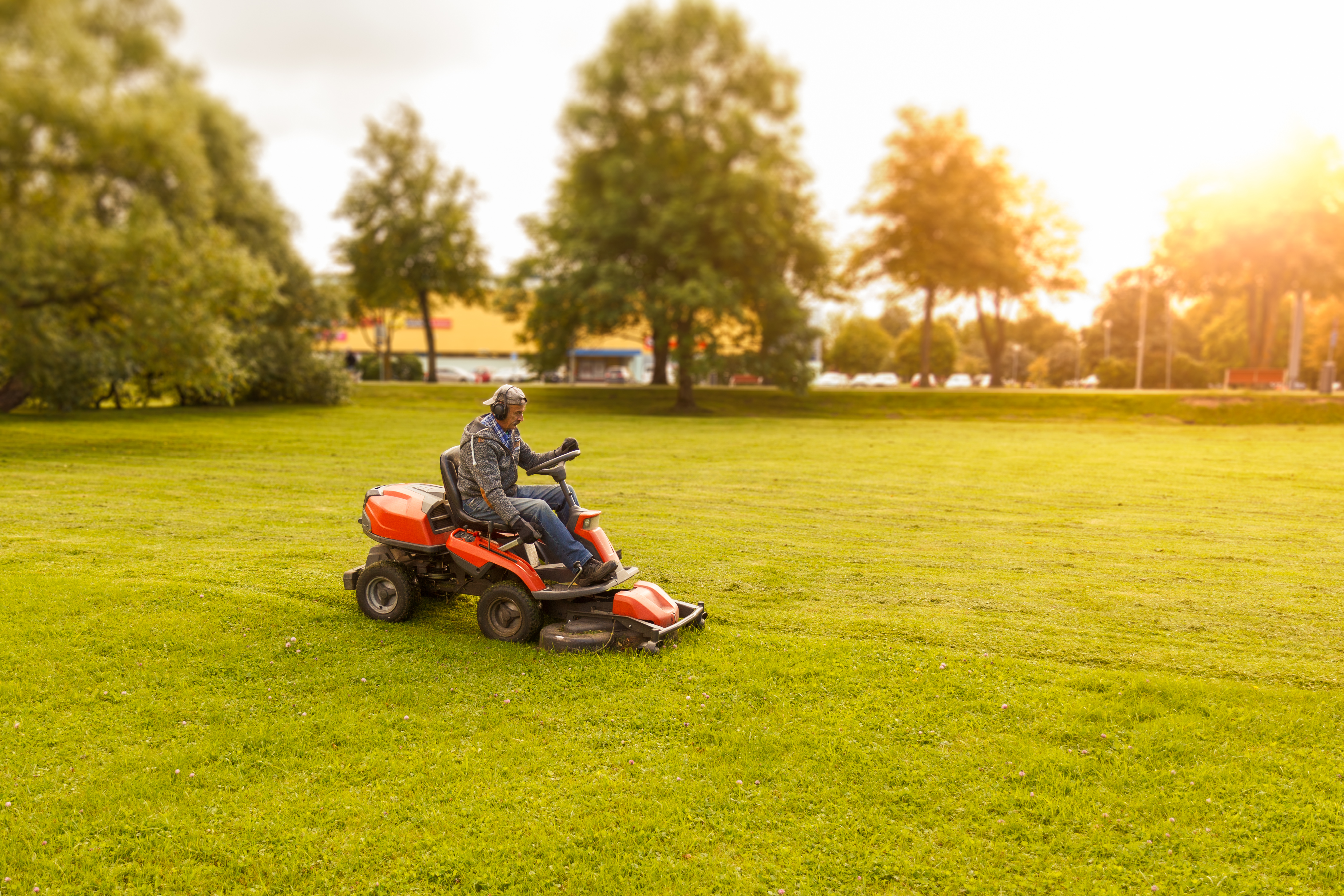 Landscaper on riding lawnmower 